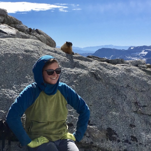 Charlotte on a mountain with a marmot