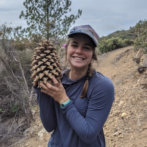 Erica holding a giant pinecone