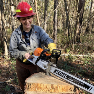 Sonya with a chainsaw
