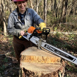 Sonya with a chainsaw.