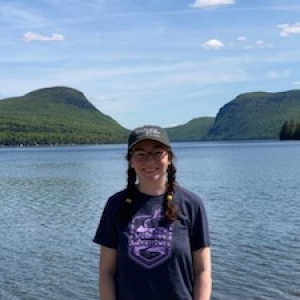 Hannah Shafer in front of lake and mountains
