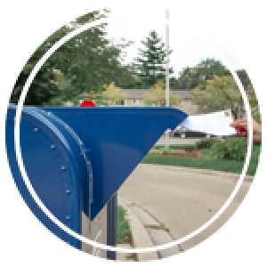 a hand dropping off mail in a post office box