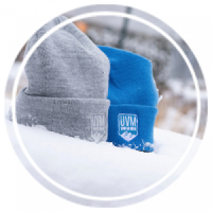 a grey and blue hat sitting in the snow