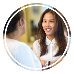 A prospective student speaks with a member of the admissions team