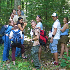 Students and instructor in woods
