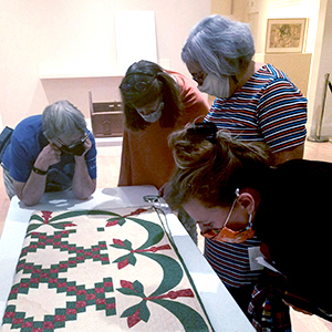 Museum visitors view objects in the Museum's Learning Studio
