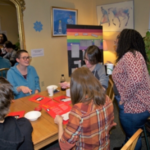 Students gathered around playing games and talking