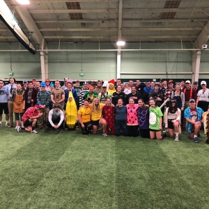 Green Mountain Battalion poses for a photo in all of their Halloween costumes at PT.