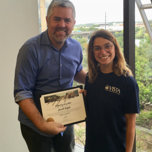 Gabby being presented with her certificate