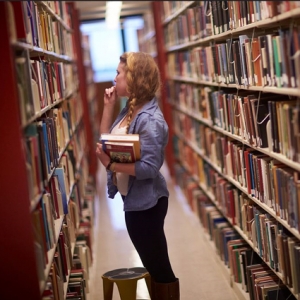 Student conducting research in the Bailey Howe Library.