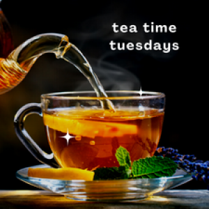 A cup of tea with a mint leaf on the saucer