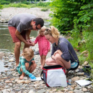 family next to river