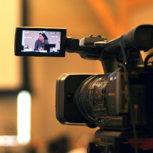 Shot of a subject on a set as seen through the viewer of a video camera