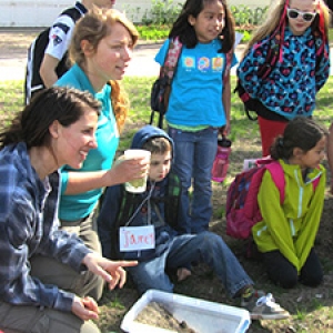 College students teaching elementary school students