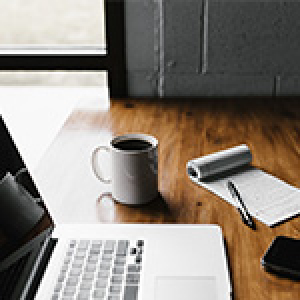 laptop computer and coffee cup