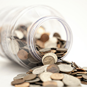 Coins spilling out of a jar