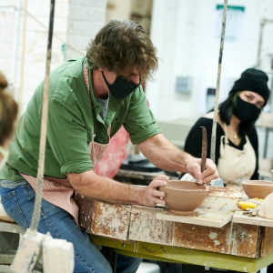 potter working in ceramics studio