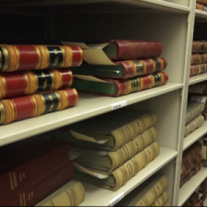 Books lay on shelves in the Vermont State Archives in Montpelier. 