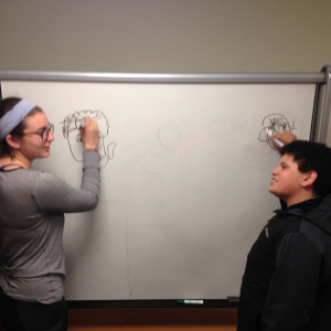 WEmentor and mentee drawing each other without looking 