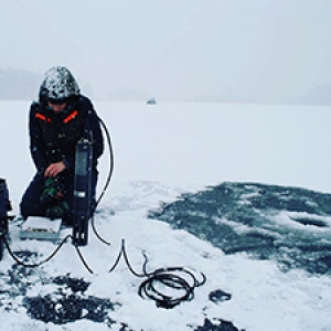 Researcher on frozen lake
