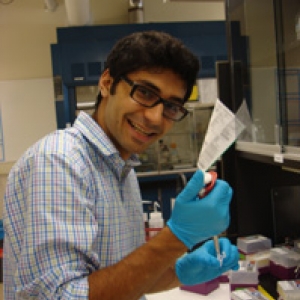  Berke Tinaz, in the lab holding a pipette