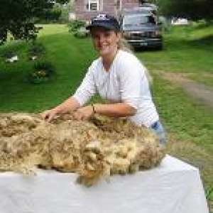 Internship mentor holding fleece 