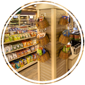 Food and coffee lining the shelves inside the cat pause convenience store