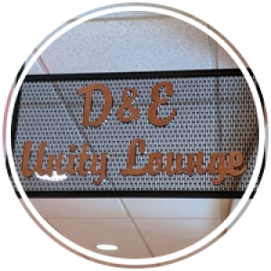 signage that says d & e unity lounge