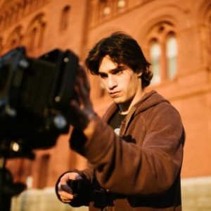 student with camera
