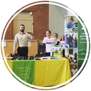 two students at a table talking about services
