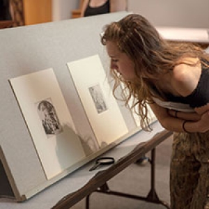 Student viewing objects from storage
