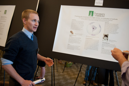 student with research poster
