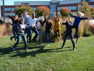 Grad students jumping in the air