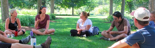Group of students in circle on lawn