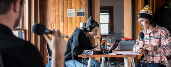Student interns record a podcast.