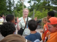 Student instructing children about birds 