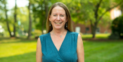 Portrait of Laura, smiling on a sunny day on UVM Green