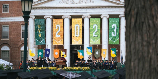 UVM Waterman Building with Class of 2023 Banner hanging from columns